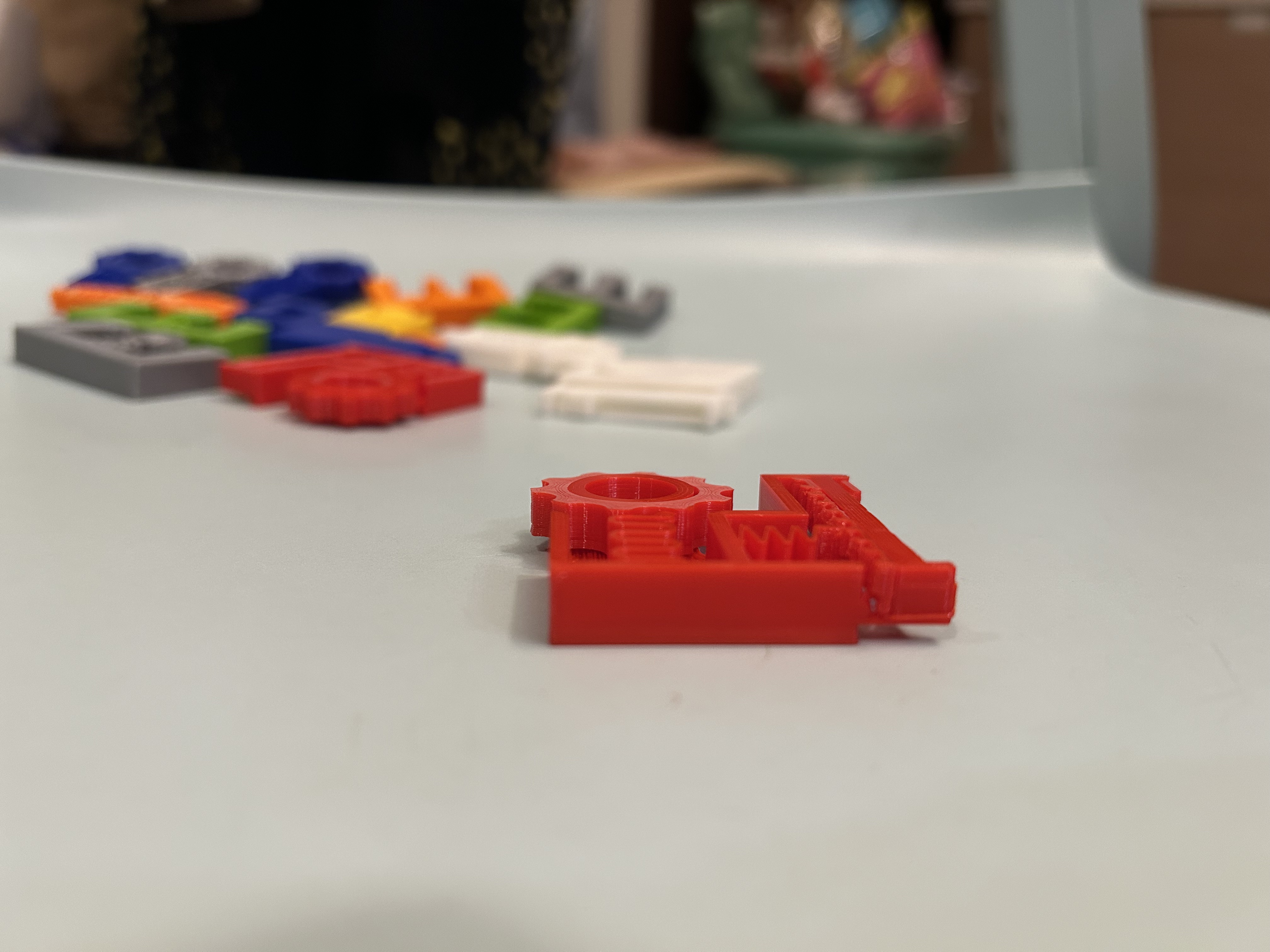 Side view of the final red fidget toy